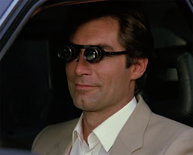 Timothy Dalton as James Bond uses a pair of Binocular Glasses in The Living Daylights